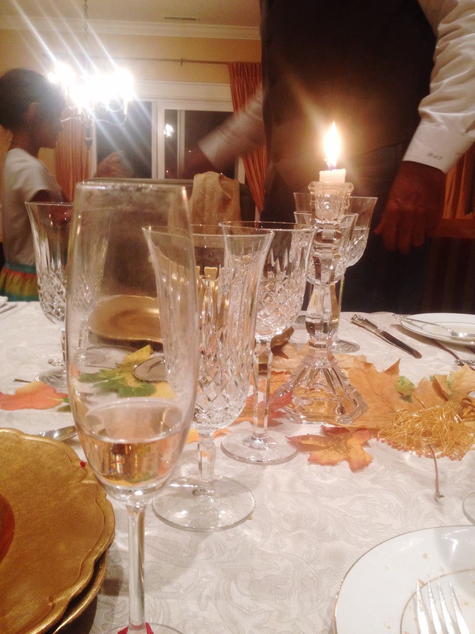 CLOSE-UP OF WINEGLASS ON TABLE AT RESTAURANT