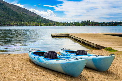 Boats moored at beach