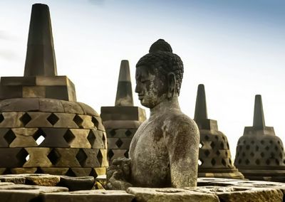 Statue of temple against sky