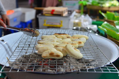 Cooking close-up of grilled banana on the charcoal stove