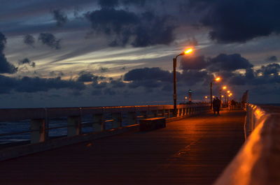 Pier on sea at dusk