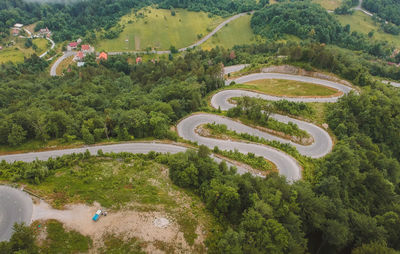 High angle view of road amidst trees and plants