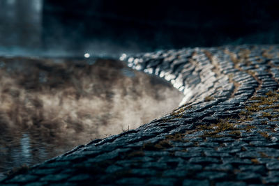 Cobblestones at lakeshore in foggy weather