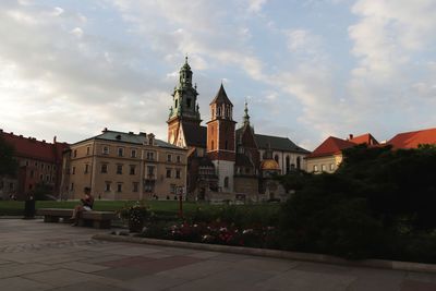 View of buildings against cloudy sky