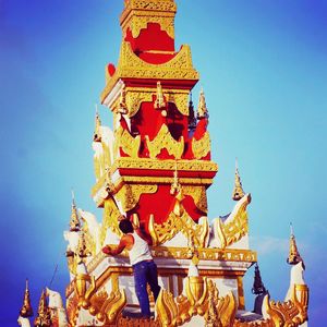 Low angle view of temple against clear blue sky