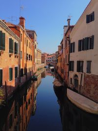 View of canal along buildings