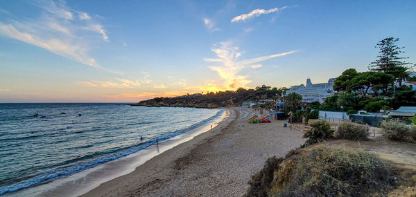 Scenic view of beach against sky during sunset