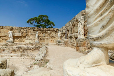 Famagusta, turkish republic of northern cyprus. columns and sculptures at ancient city salamis ruins