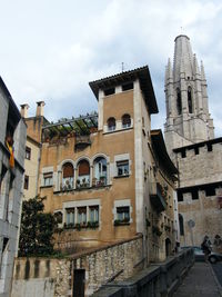 Low angle view of buildings against sky in city