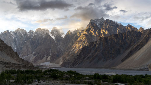 Panoramic view of snowcapped mountains against sky