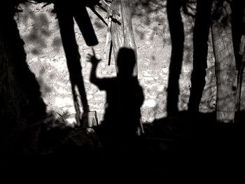 Shadow of silhouette woman standing on floor