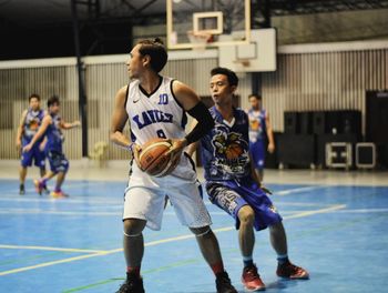 Full length of boys playing basketball
