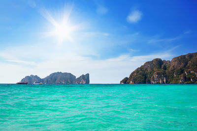 Panoramic view of sea against blue sky