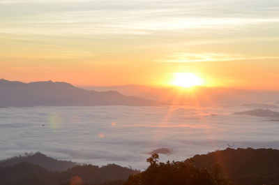 Scenic view of silhouette mountains against sky during sunset