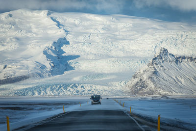 Scenic view of snowcapped mountains during winter