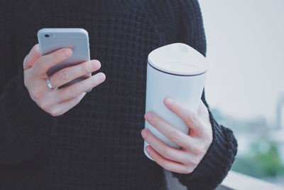 Close-up of hand holding smart phone