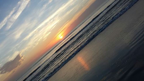 Scenic view of sea against sky at sunset