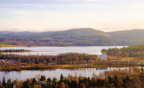 Scenic view of lake and mountains against sky