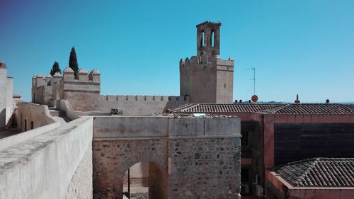 Exterior of old building against clear blue sky