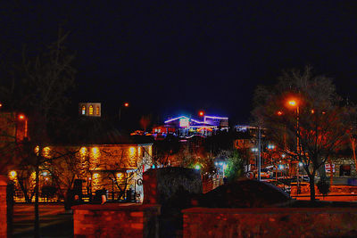 Illuminated buildings in city at night