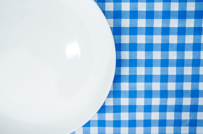 High angle view of white plate on table