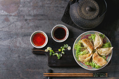 High angle view of various fruits in bowl on table