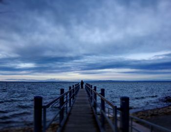 Pier over sea against sky