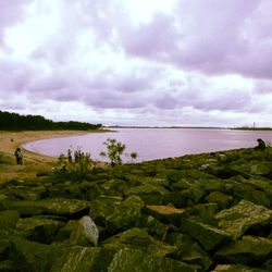 Scenic view of sea against cloudy sky