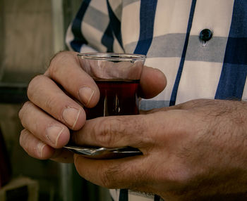 Close-up of hand holding drink