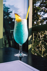 Tropical cocktails with pineapple and straw in glasses. pina colada. blue curacao. 