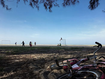 People on field against sky