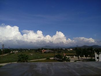 Scenic view of landscape against cloudy sky