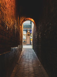 Empty alley along buildings