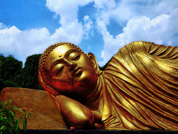 Low angle view of statue against sky