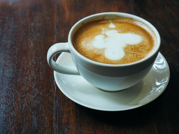 High angle view of cappuccino on table