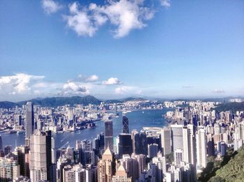 Cityscape against cloudy sky