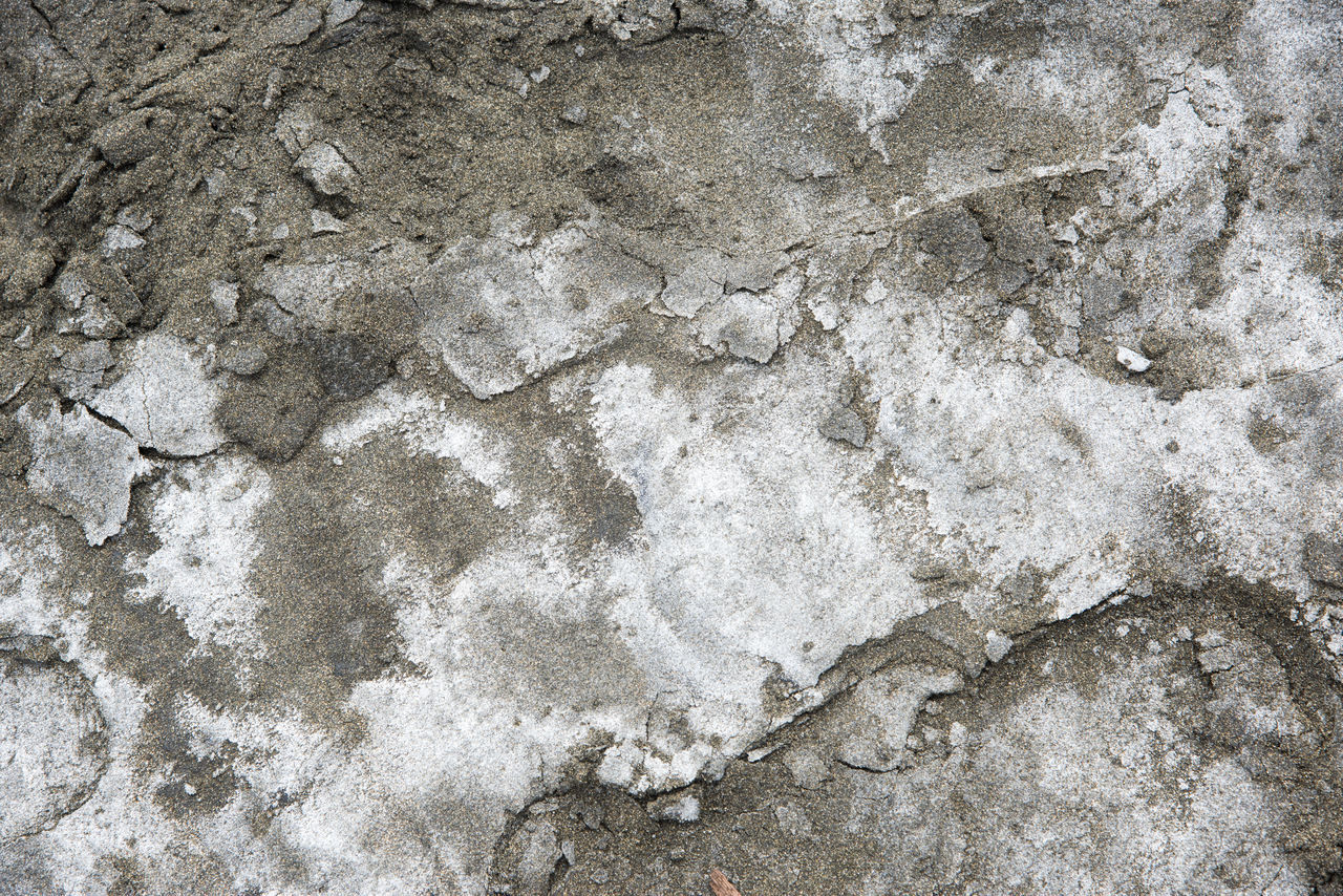 FULL FRAME SHOT OF ROCKS ON WALL