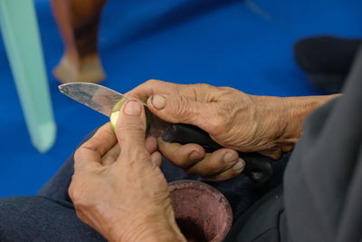 Midsection of man holding hands