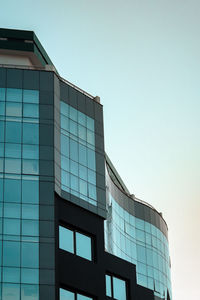 Low angle view of modern buildings against clear sky