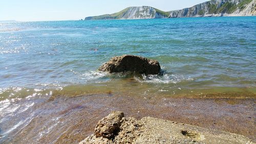 Scenic view of sea against blue sky