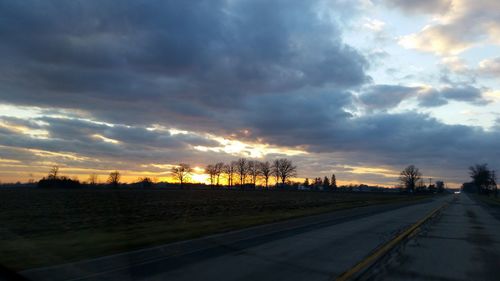 Road against dramatic sky during sunset