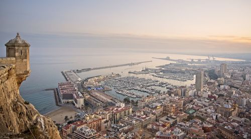 High angle view of city buildings during sunset