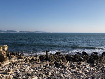 Scenic view of sea against clear sky