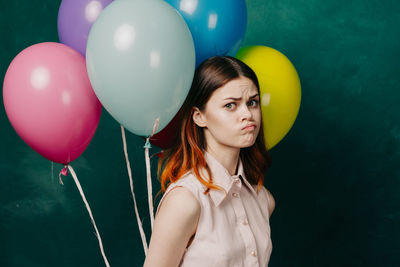 Midsection of woman with balloons