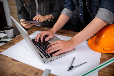 Low angle view of man using mobile phone