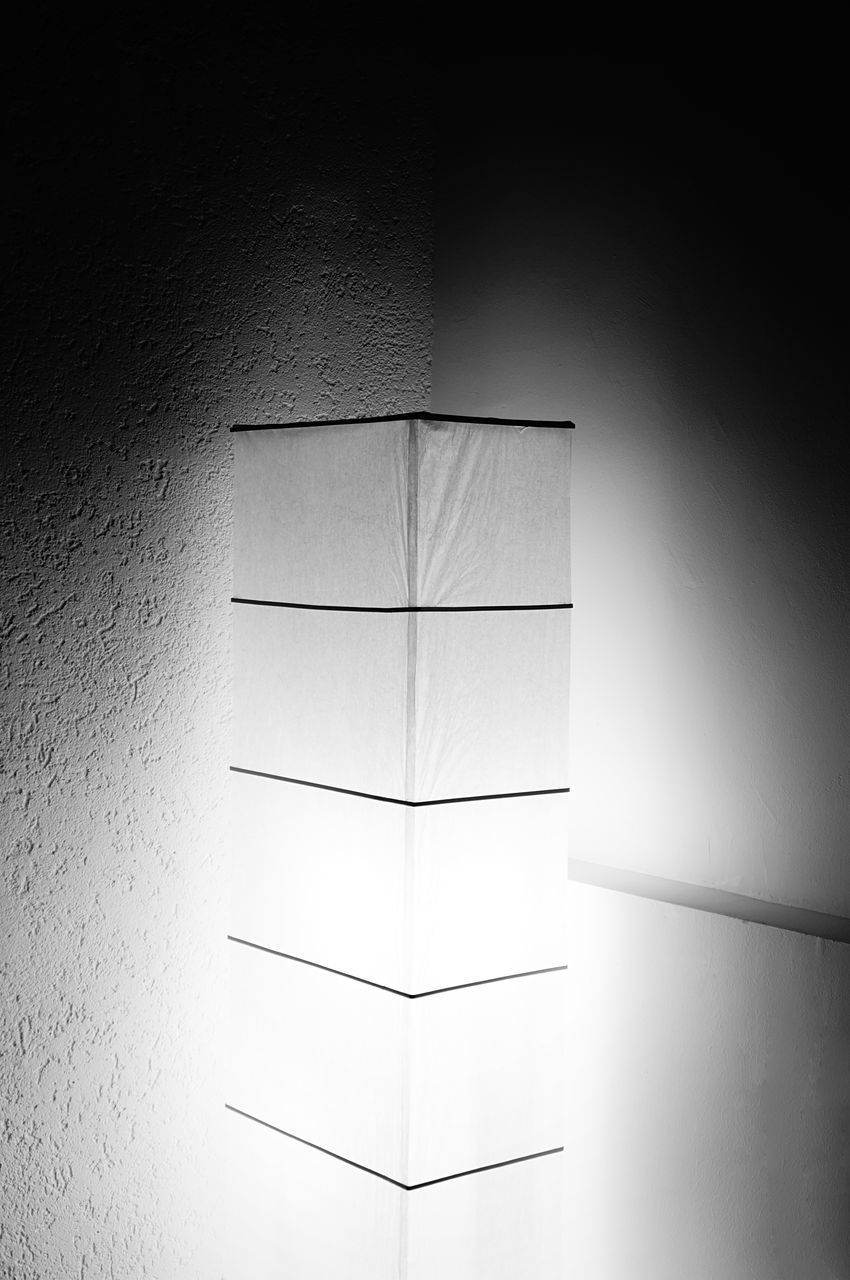 LOW ANGLE VIEW OF ILLUMINATED LAMP AGAINST WALL