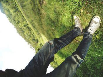 Person standing on grassy field