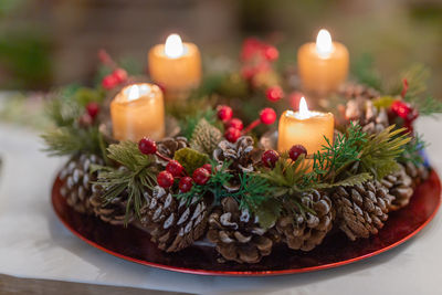 High angle view of illuminated candles on table