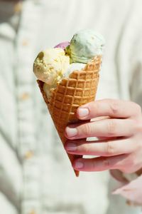 Midsection of man ice cream cone