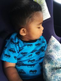 Baby boy sleeping in vehicle